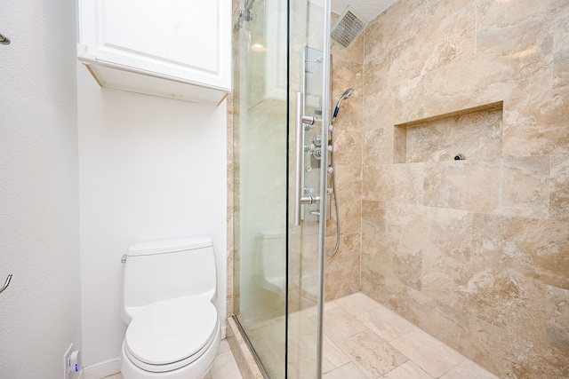 bathroom with walk in shower and toilet