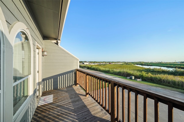 wooden deck featuring a water view