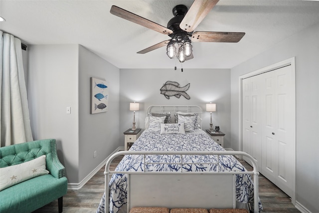 bedroom featuring ceiling fan, a closet, and dark hardwood / wood-style floors