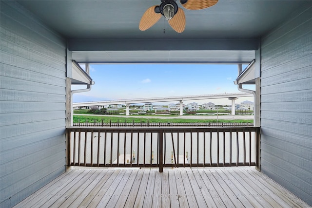 wooden deck featuring ceiling fan