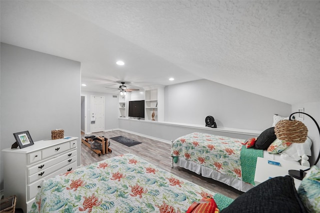 bedroom with light wood-type flooring, a textured ceiling, and ceiling fan