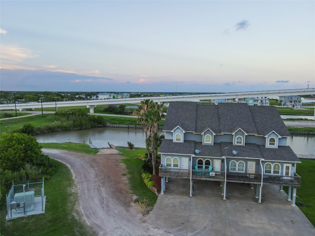 aerial view at dusk with a water view