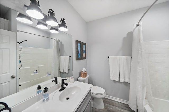 full bathroom featuring shower / bath combo, vanity, toilet, and wood-type flooring