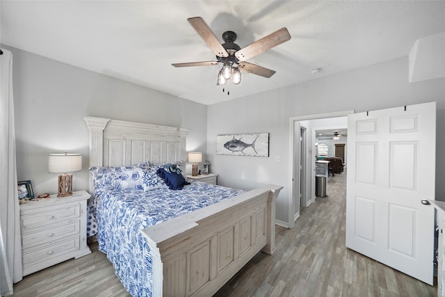 bedroom featuring ceiling fan and light hardwood / wood-style flooring