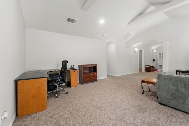 carpeted home office featuring lofted ceiling