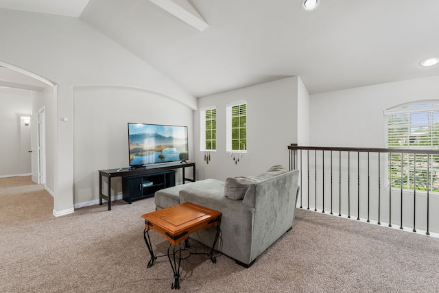 carpeted living room featuring vaulted ceiling and plenty of natural light