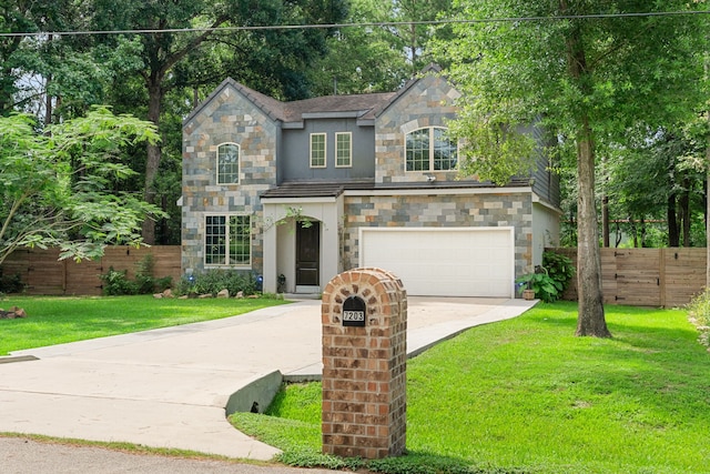 view of front of property featuring a garage and a front lawn