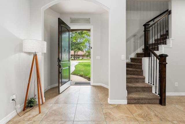 foyer entrance featuring light tile patterned flooring