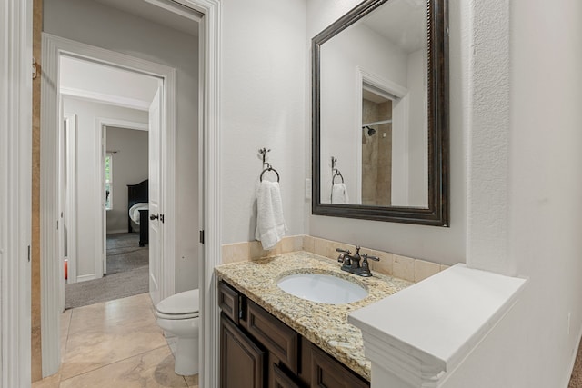 bathroom featuring walk in shower, vanity, toilet, and tile patterned floors