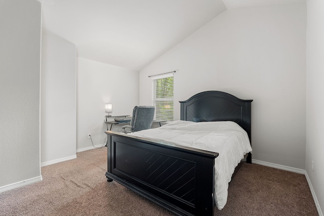 carpeted bedroom with lofted ceiling