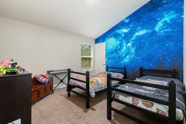 bedroom with lofted ceiling and light carpet