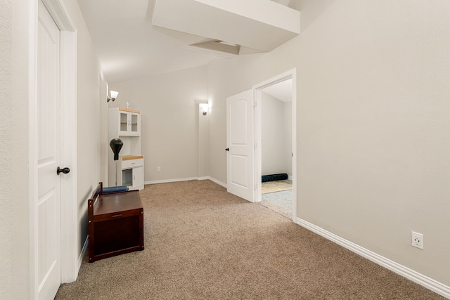 hallway with carpet flooring