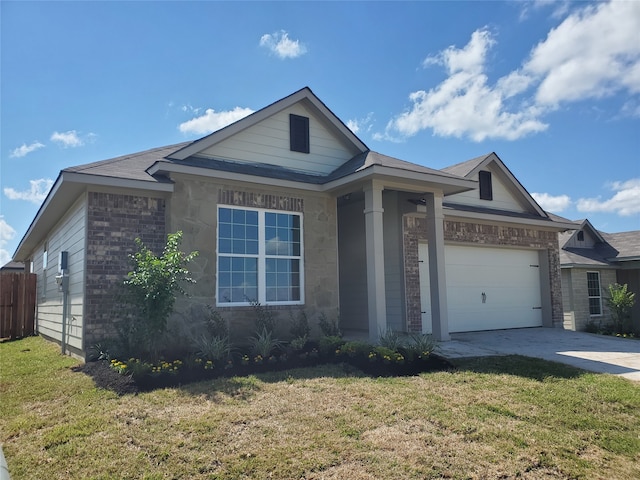 view of front of house with a garage and a front yard