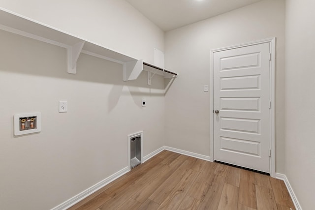 laundry room with washer hookup, hookup for an electric dryer, and light wood-type flooring