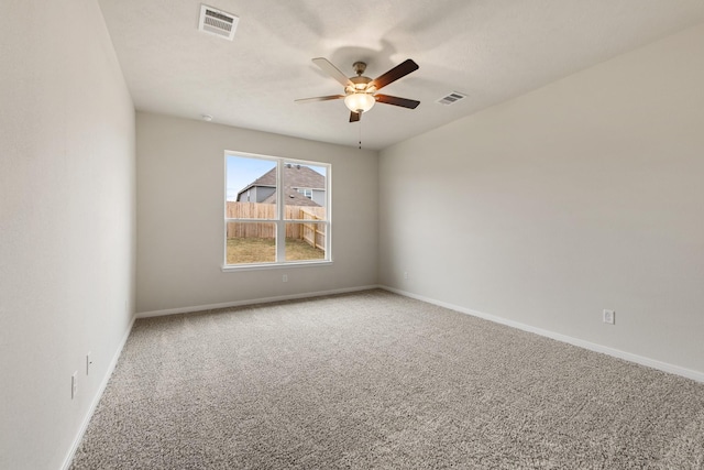 empty room featuring carpet floors and ceiling fan