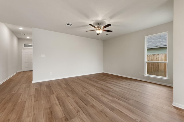 spare room featuring ceiling fan and light hardwood / wood-style flooring