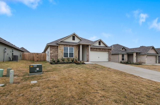 view of front of house with a garage, central air condition unit, and a front lawn