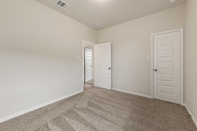 unfurnished room with carpet flooring