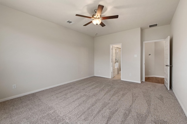 unfurnished bedroom with connected bathroom, ceiling fan, and carpet