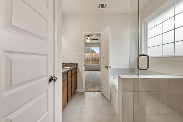 bathroom with vanity, independent shower and bath, and tile patterned flooring