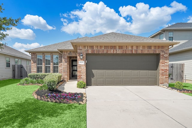 view of front of house with a garage and a front yard