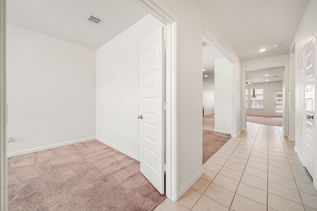 corridor with light colored carpet