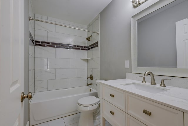 full bathroom with tiled shower / bath combo, vanity, and toilet