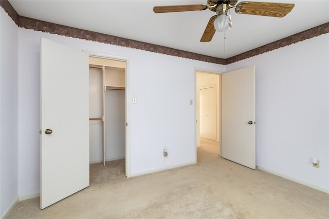 unfurnished bedroom with a closet, ceiling fan, and light colored carpet