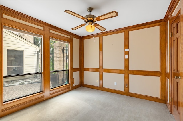 interior space with light carpet and ceiling fan