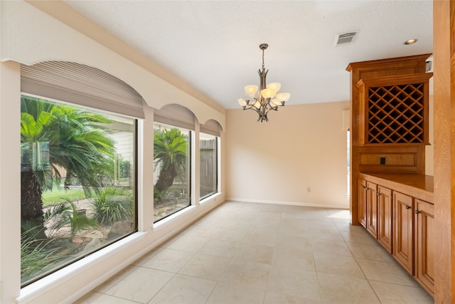 dining room with a notable chandelier