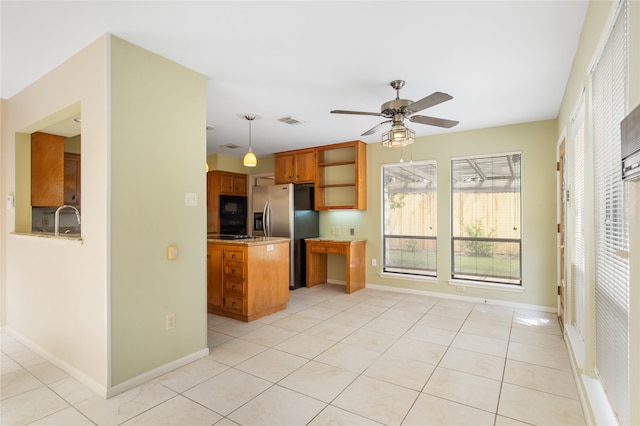 kitchen with stainless steel refrigerator with ice dispenser, light tile patterned floors, and ceiling fan