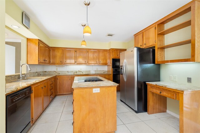 kitchen featuring hanging light fixtures, light tile patterned floors, sink, a kitchen island, and black appliances