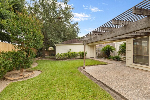 view of yard with a pergola and a patio area