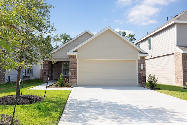 view of front of house featuring a garage and a front yard