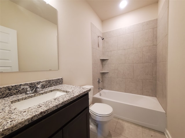 full bathroom featuring tile patterned flooring, vanity, toilet, and tiled shower / bath