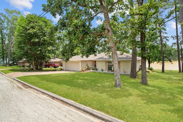 single story home with a front lawn and a garage