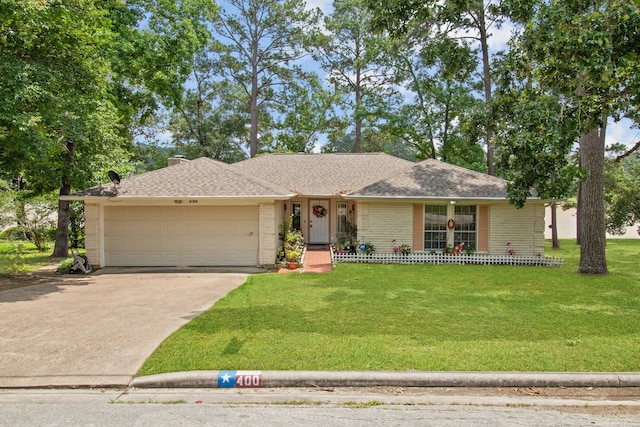 ranch-style house featuring a front yard and a garage