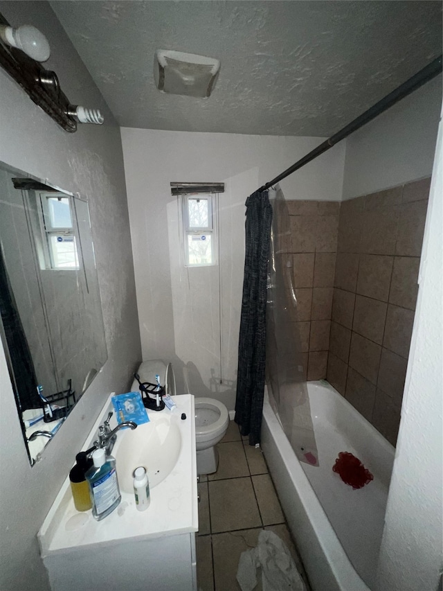 full bathroom featuring shower / bathtub combination with curtain, vanity, a textured ceiling, toilet, and tile patterned floors