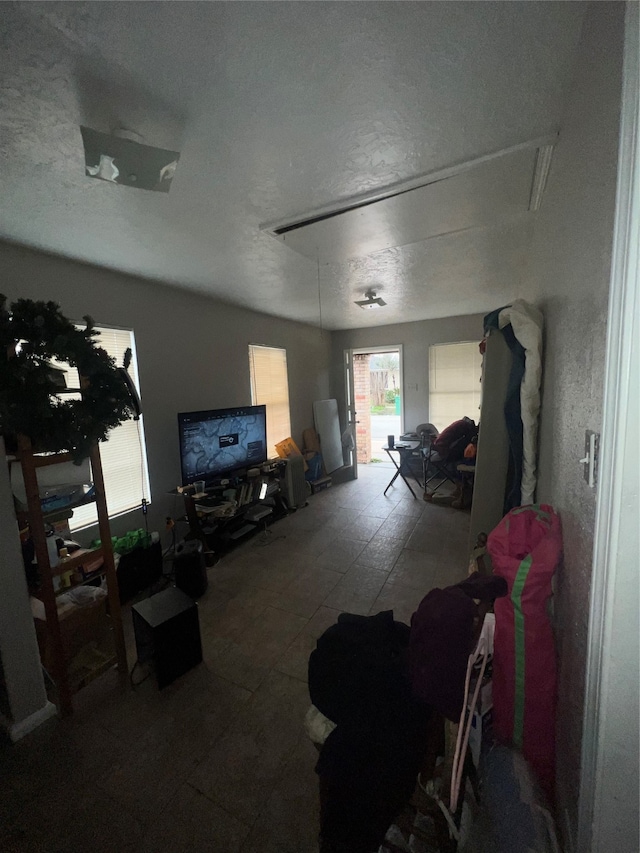 living room with a textured ceiling