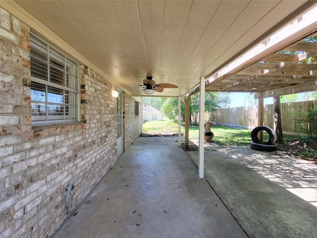 view of patio / terrace with ceiling fan and a pergola