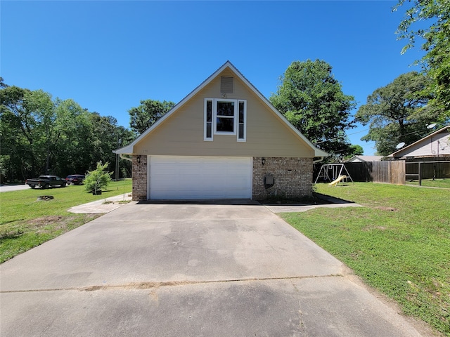 view of front of house with a garage and a front yard