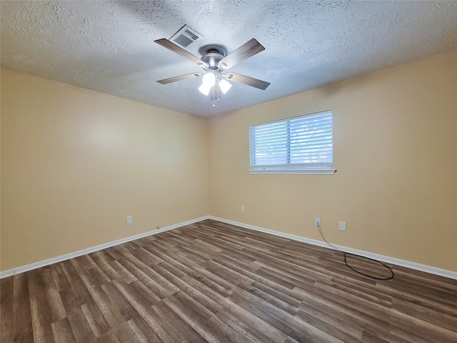 spare room featuring ceiling fan, a textured ceiling, and hardwood / wood-style floors