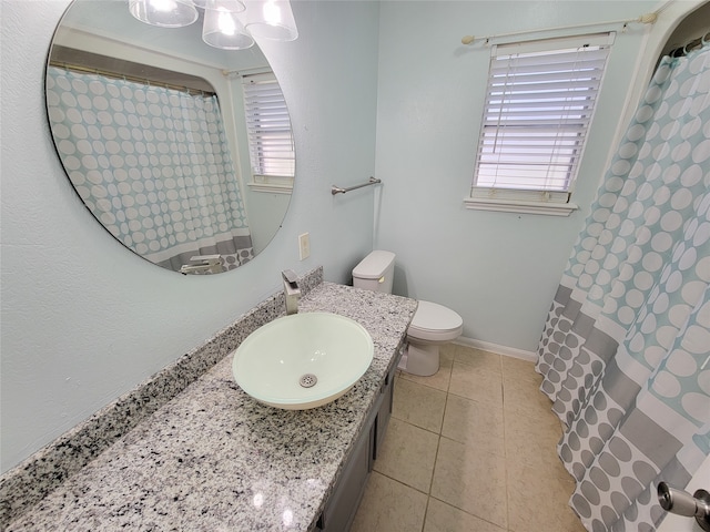 bathroom featuring vanity, toilet, and tile patterned floors