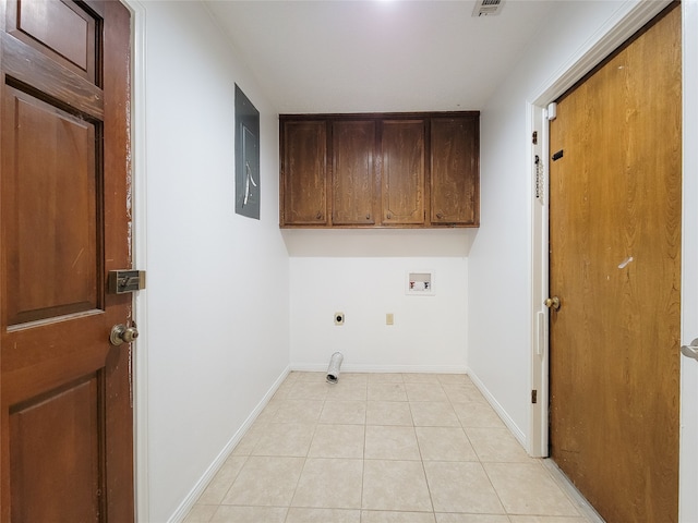 laundry area with washer hookup, electric dryer hookup, cabinets, and light tile patterned floors