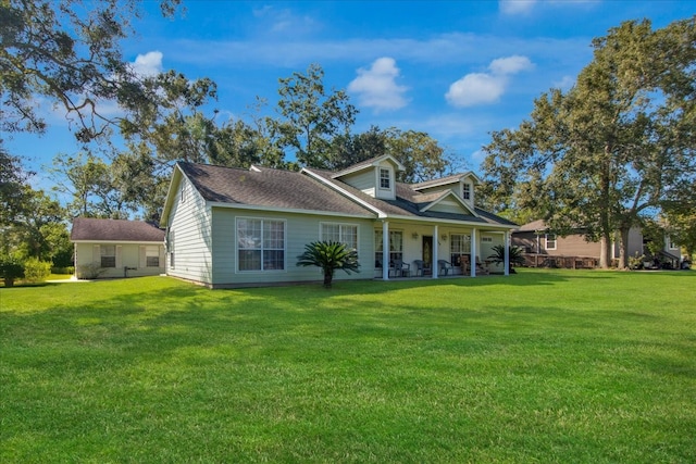 rear view of house with a lawn