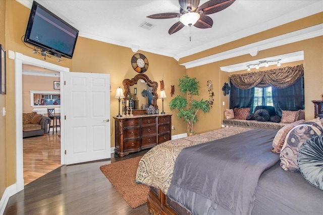 bedroom with ornamental molding, ceiling fan, and dark hardwood / wood-style flooring