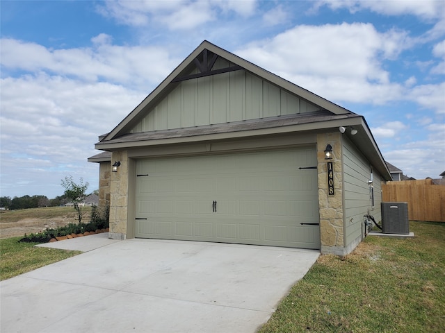 exterior space with an outbuilding, a garage, and central air condition unit