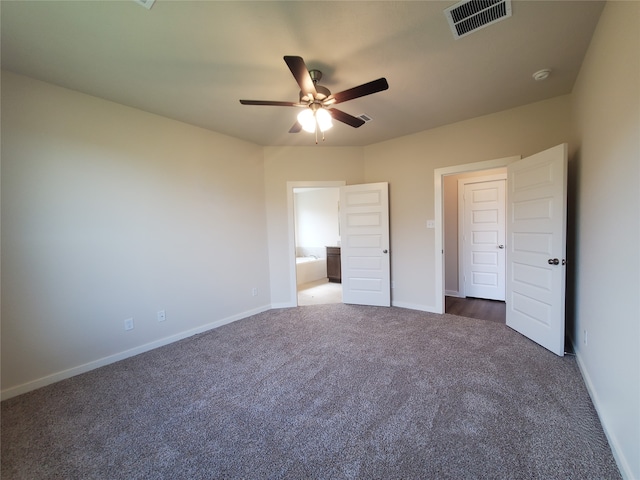 unfurnished bedroom featuring dark colored carpet and ceiling fan