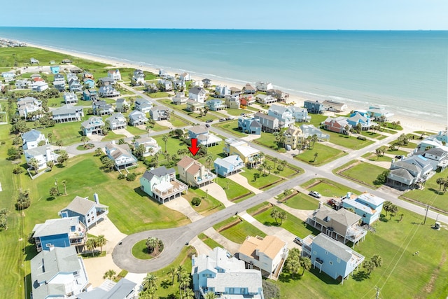 bird's eye view featuring a view of the beach and a water view