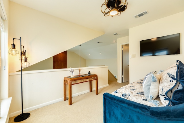 living room featuring vaulted ceiling and light carpet